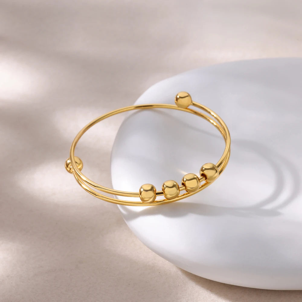 Aurum Coil Bracelet™ - Encircle the wrist, embody the infinite.